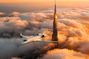 Dubai Air Show debut for FAI Aviation Group - D-AFAM flying past the Burj Khalifa
