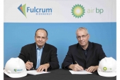 R E.James Macias, President and CEO of Fulcrum, signs agreement with David Gilmour, Vice President T